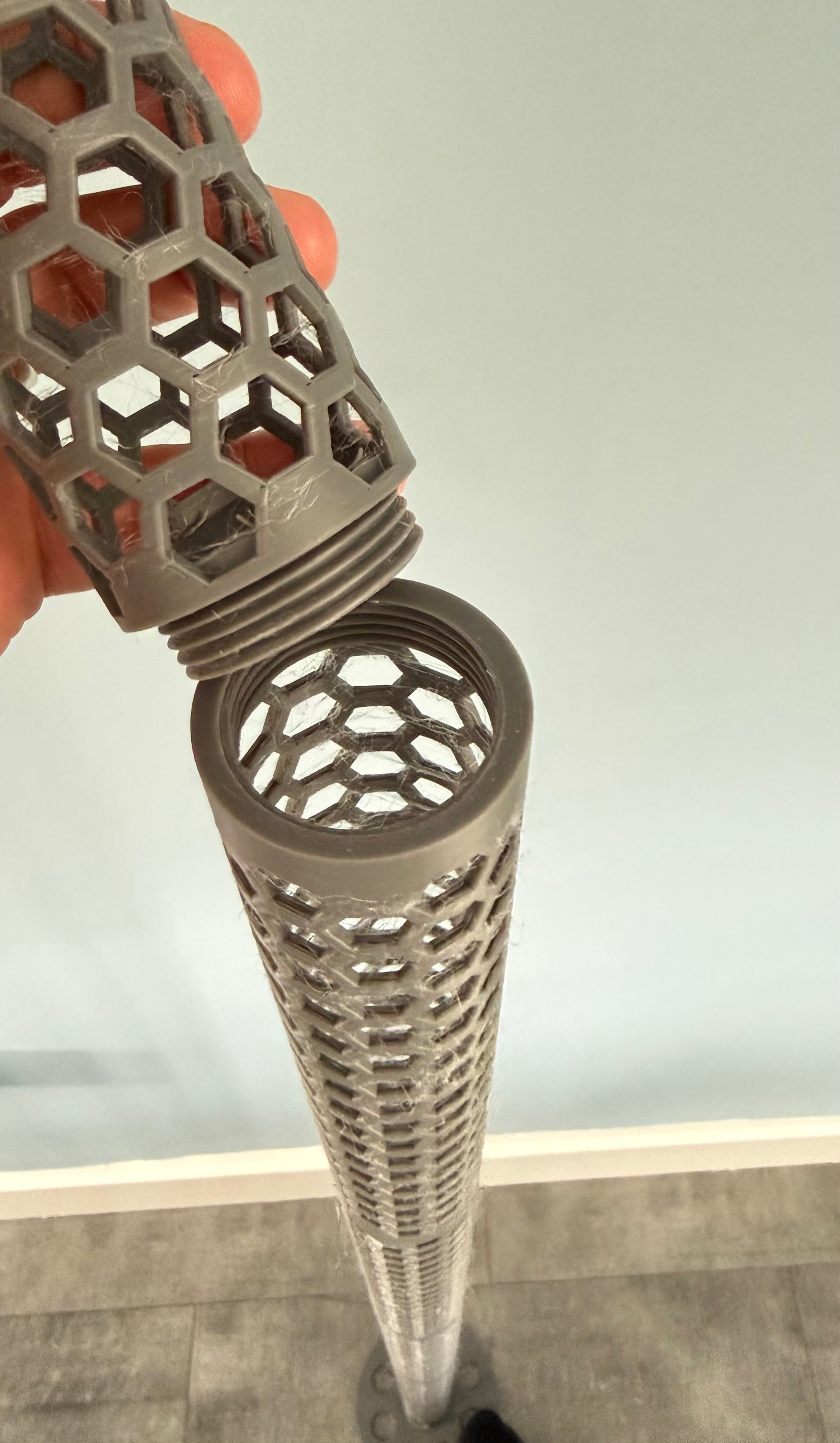 Close-up of Modular Moss Pole Kit screw-thread connection joining two pole sections by hand