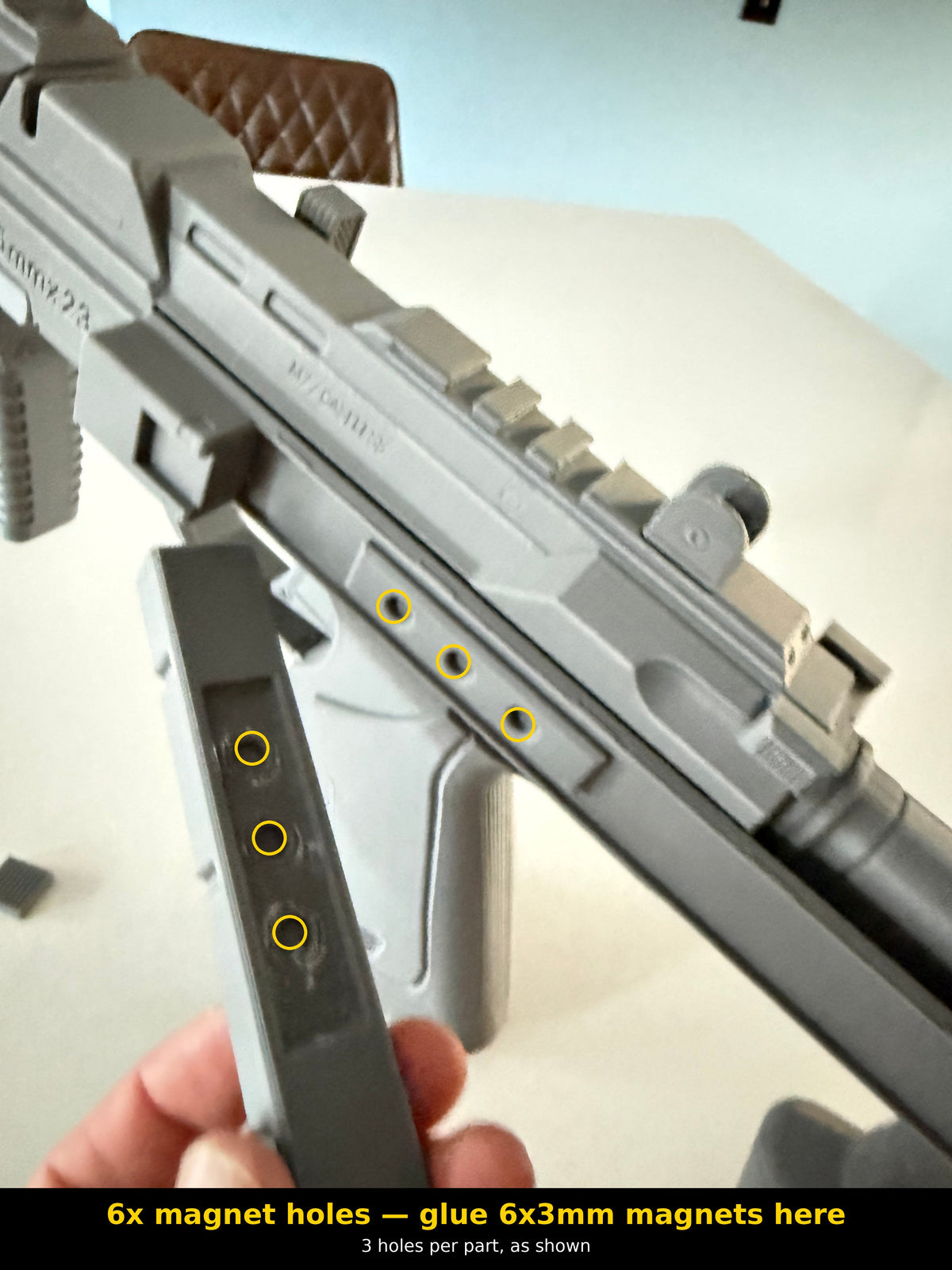 M7 Caseless SMG prop kit magnet installation guide: 6 magnet holes circled, 3 in the mag catch part and 3 in the receiver, for gluing 6x3mm magnets