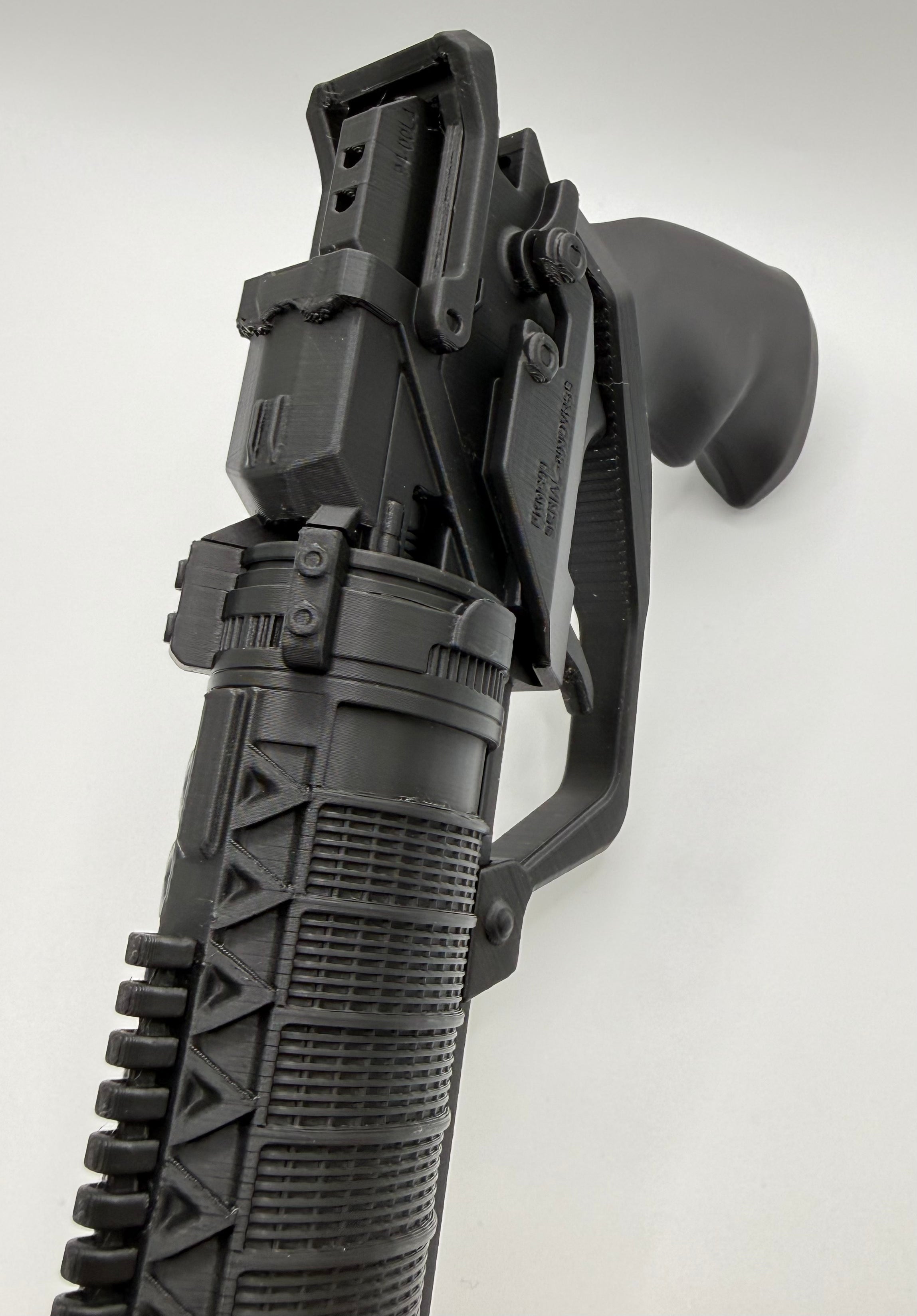 3D printed K's Blaster kit, close-up of the rear sight and grip on a white background