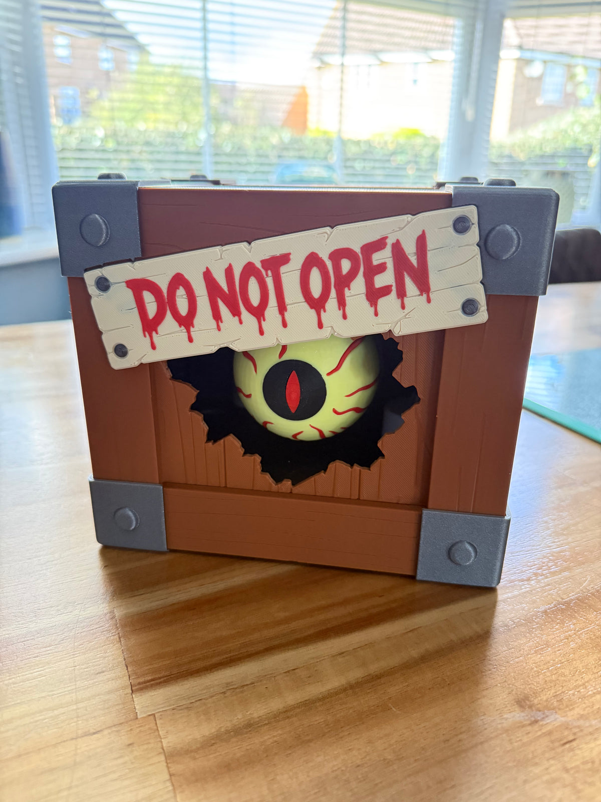 Spooky Halloween box open, showing glow-in-the-dark eyeball inside