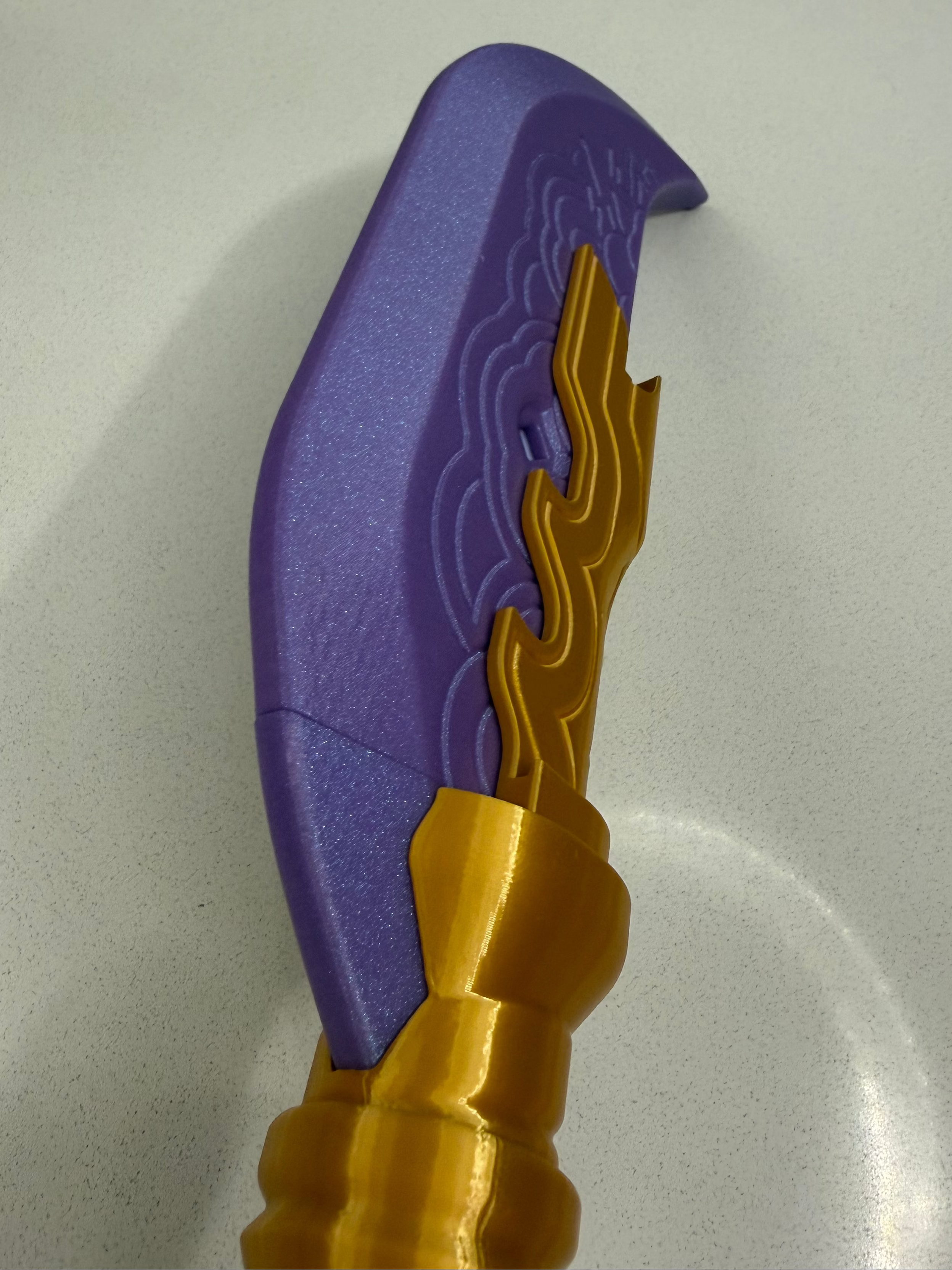 Mira's Glaive Celestial Stone variant, vivid purple glitter sparkle finish detail