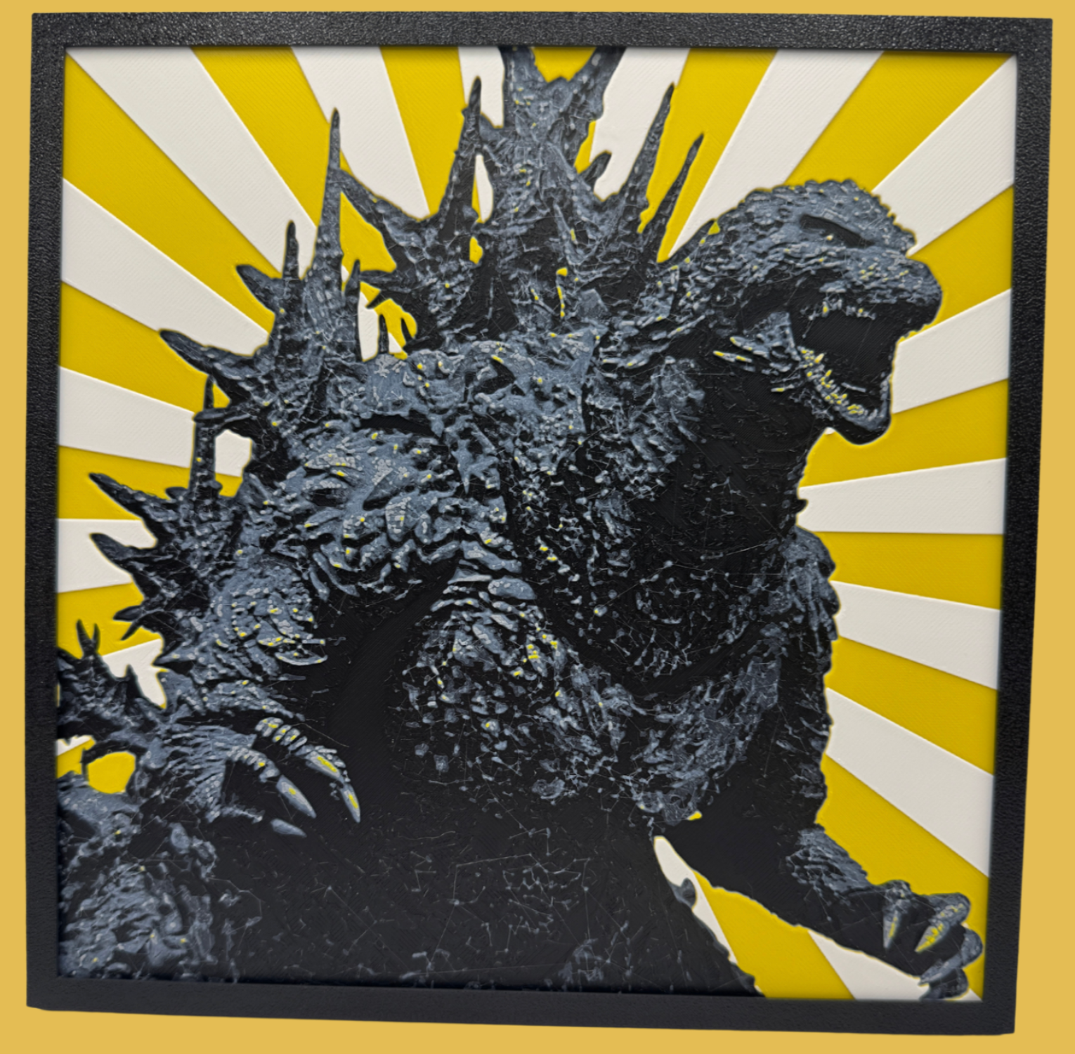 Godzilla figure with a yellow and white striped background