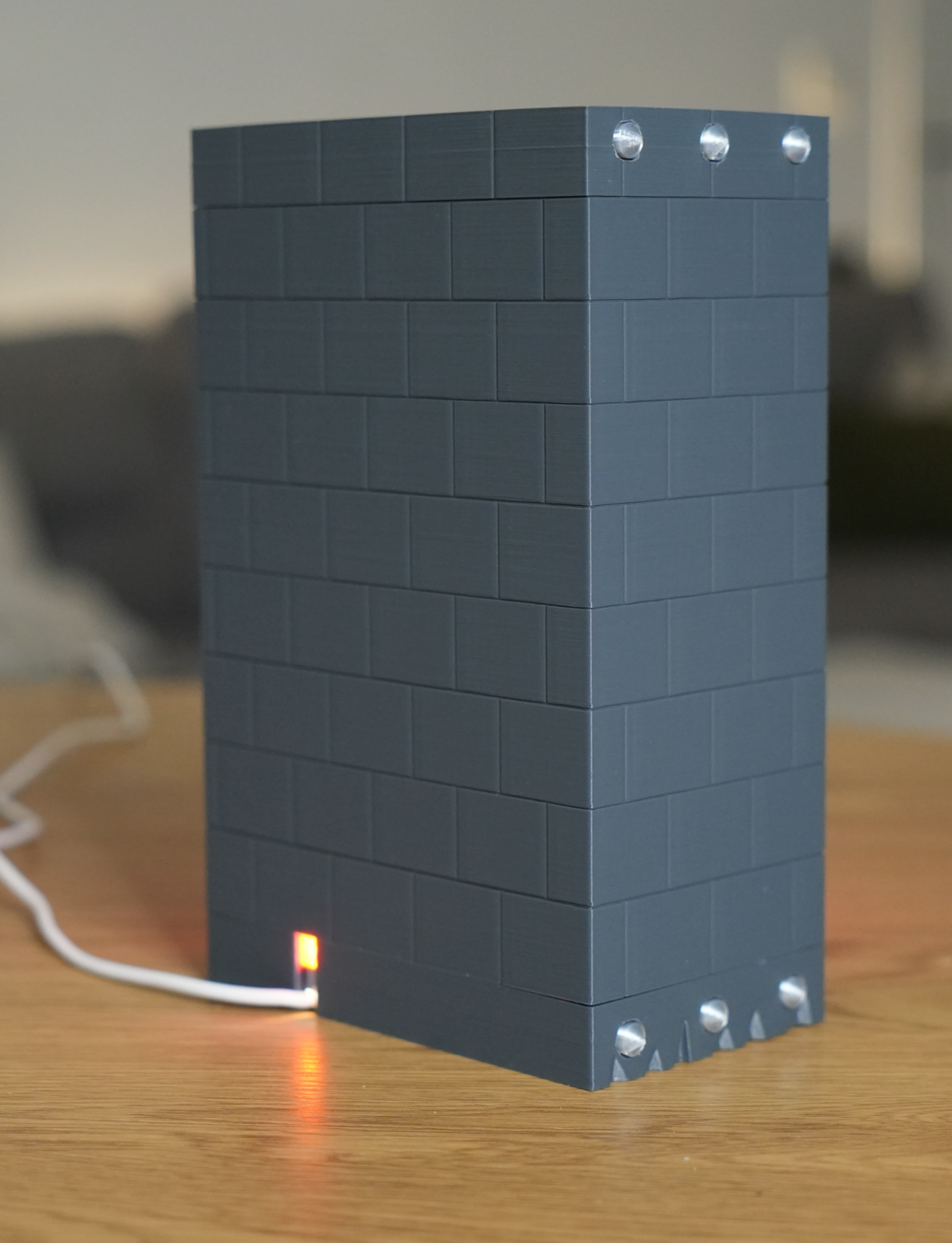Broken Brick Bowser LED night light, rear view showing USB cable and inline on/off indicator light