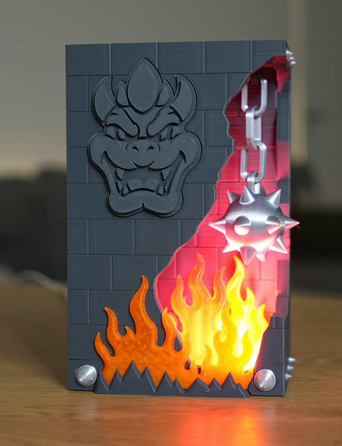 Broken Brick Bowser LED night light, lit version glowing, straight-on front view