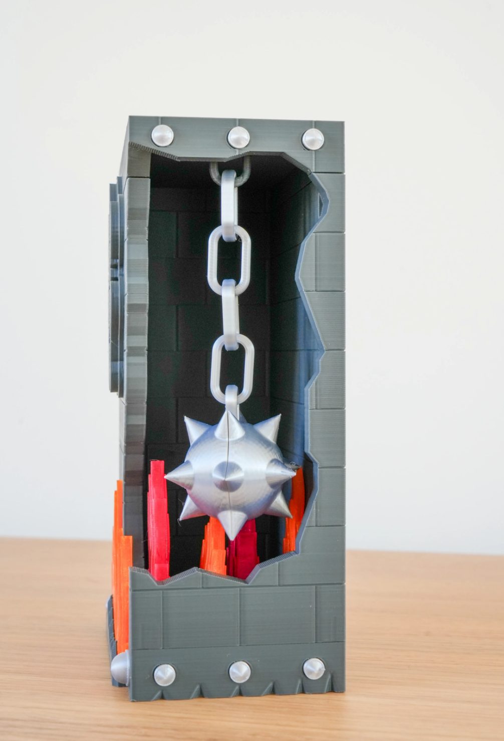 Broken Brick Bowser diorama, close-up interior view of the spiked wrecking ball and chain inside the broken brick